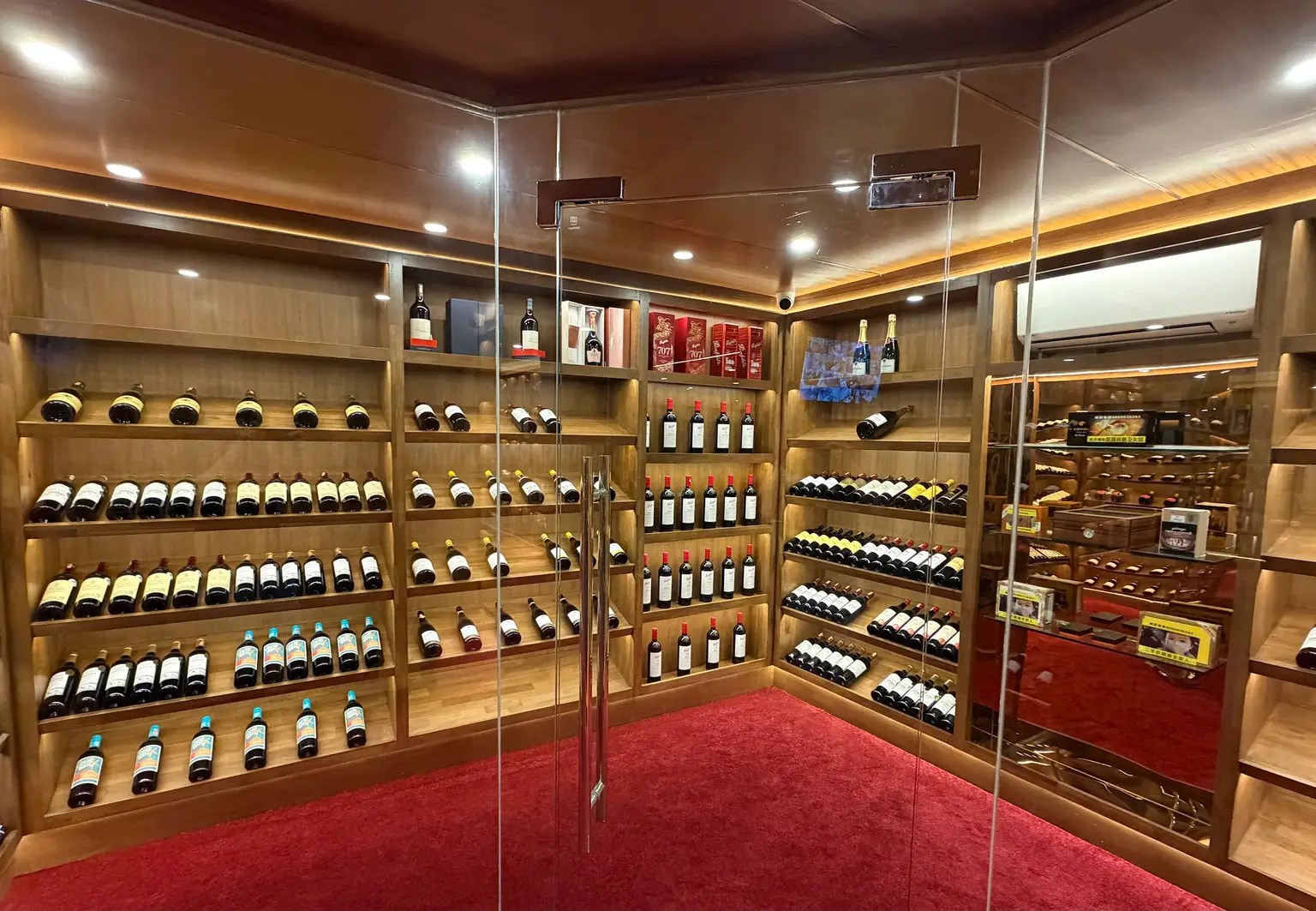 The glass-walled wine cellar